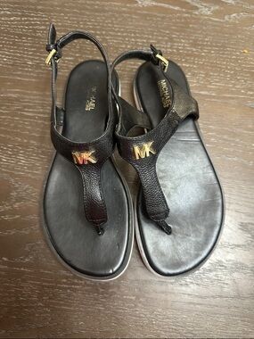MICHAEL Michael Kors Black Leather T-Strap Sandals with Gold MK Logo